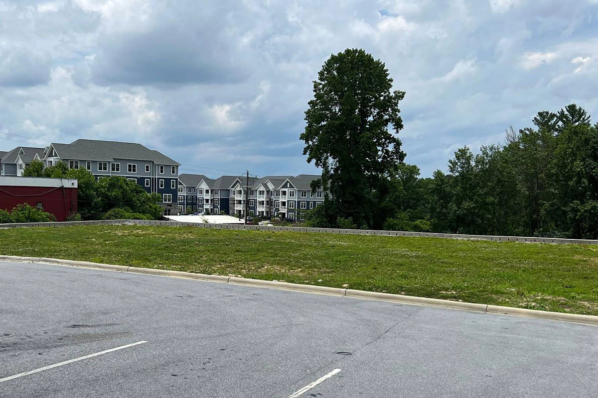 Second angle from same side showing pad and residential context