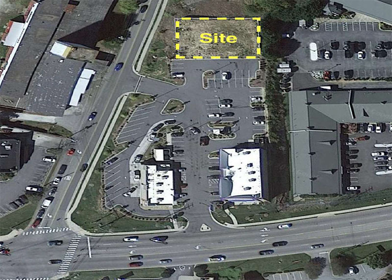 Aerial view of the development parcel site with boundary shown in yellow